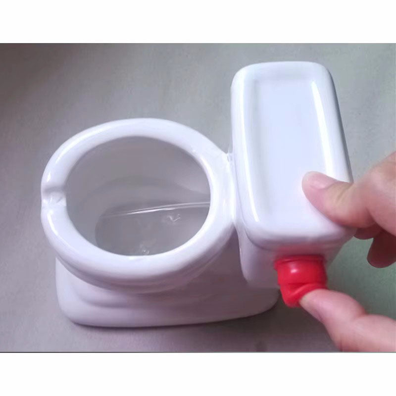 Funny toilet ashtray that sprays water