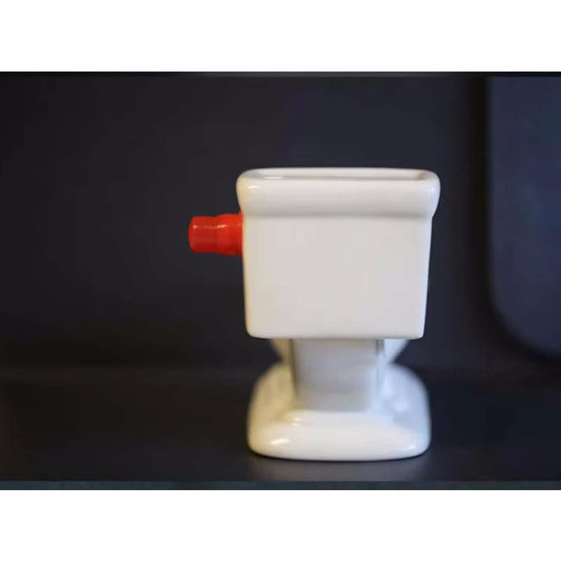Funny toilet ashtray that sprays water