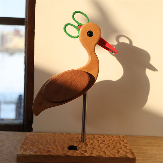 Add a charming touch to your workspace with Wooden Bird Scissor Holder